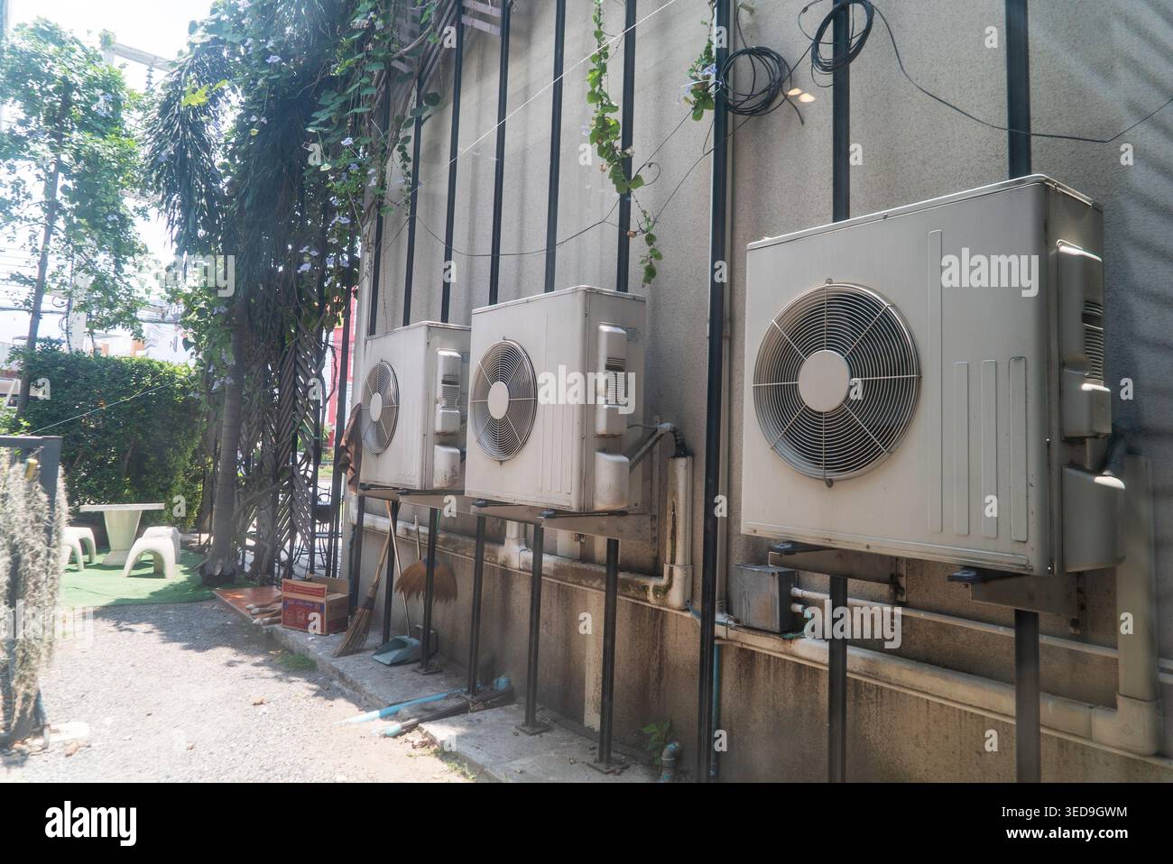 This image shows multiple outdoor air conditioning units mounted on the ...