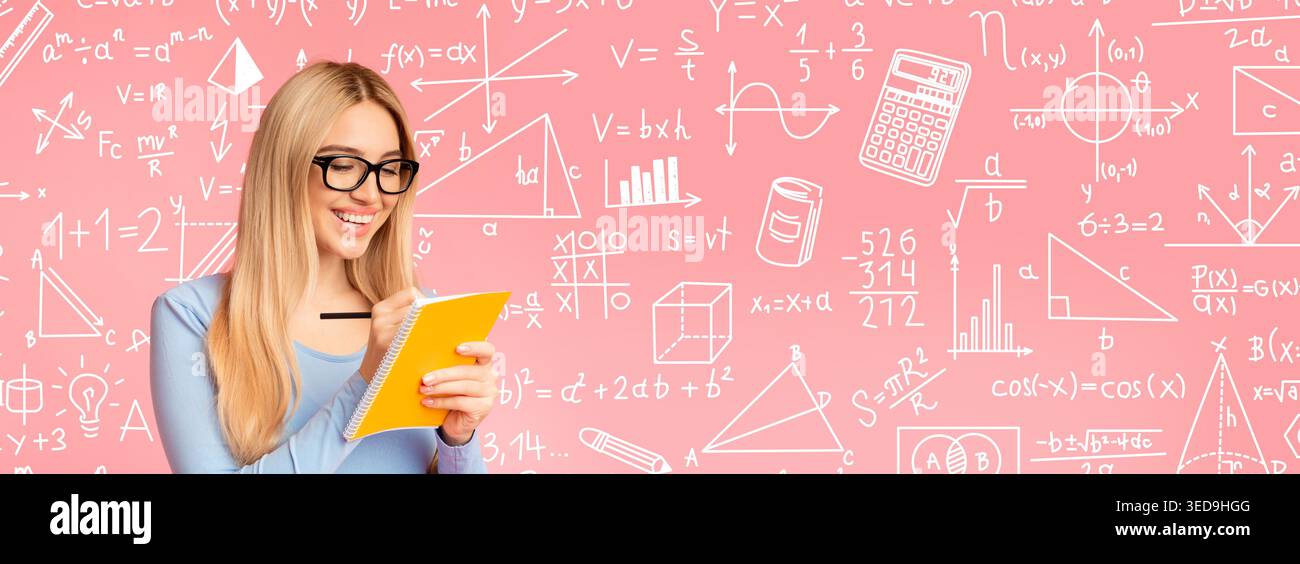 Woman Writing Notes in a Notebook While Studying Math on a Pink Background Stock Photo
