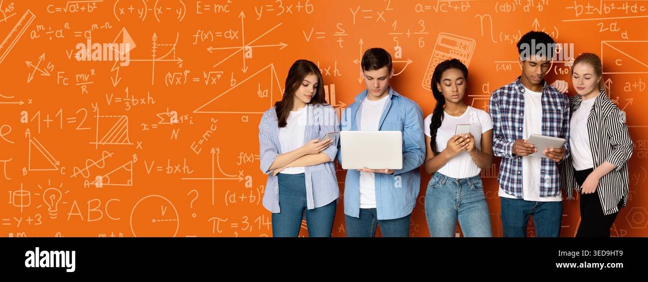 Collection of Students Using Devices in a Learning Space With Math and Science Notes on the Wall Stock Photo