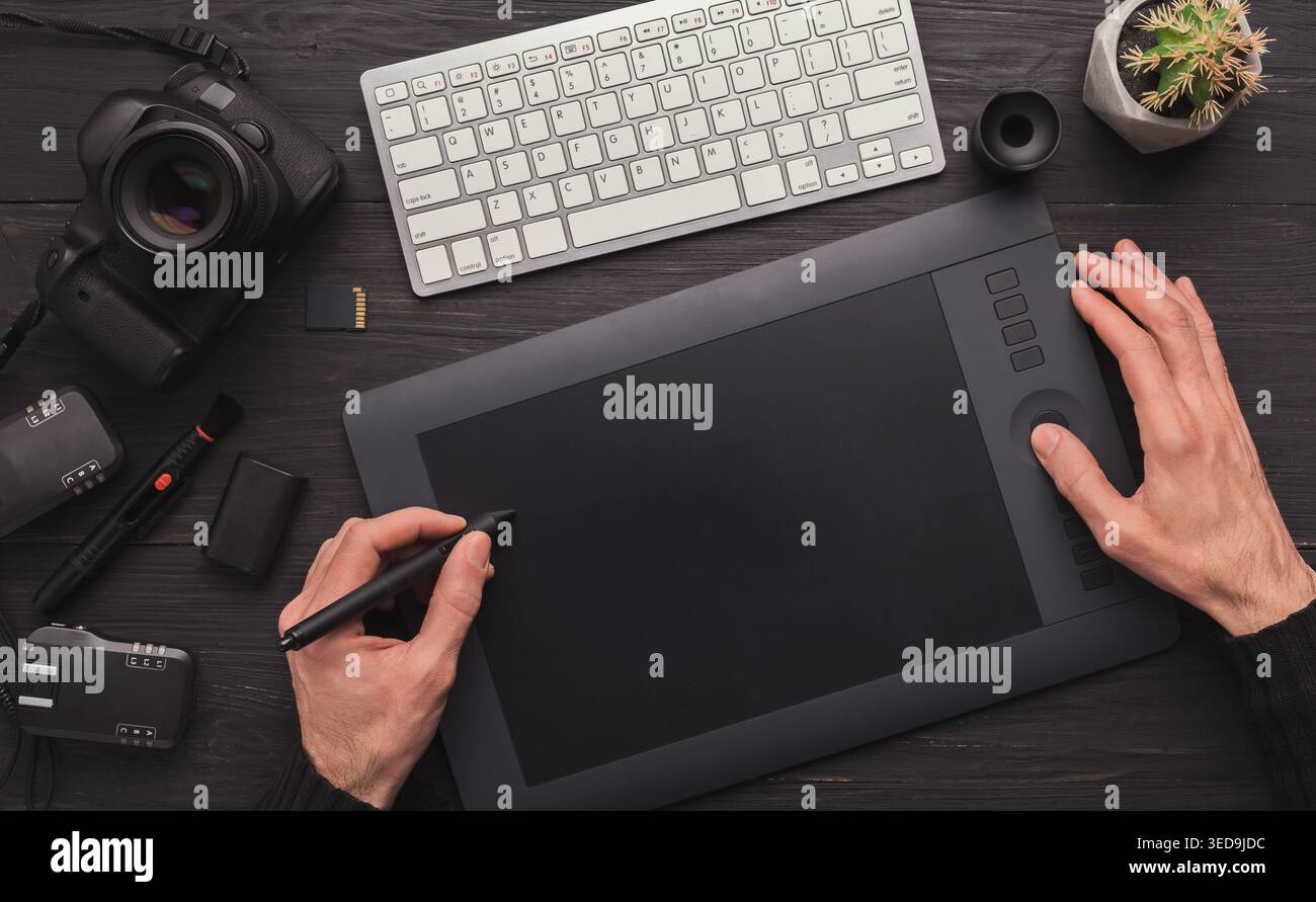 Designer hand with graphic tablet and keyboard Stock Photo