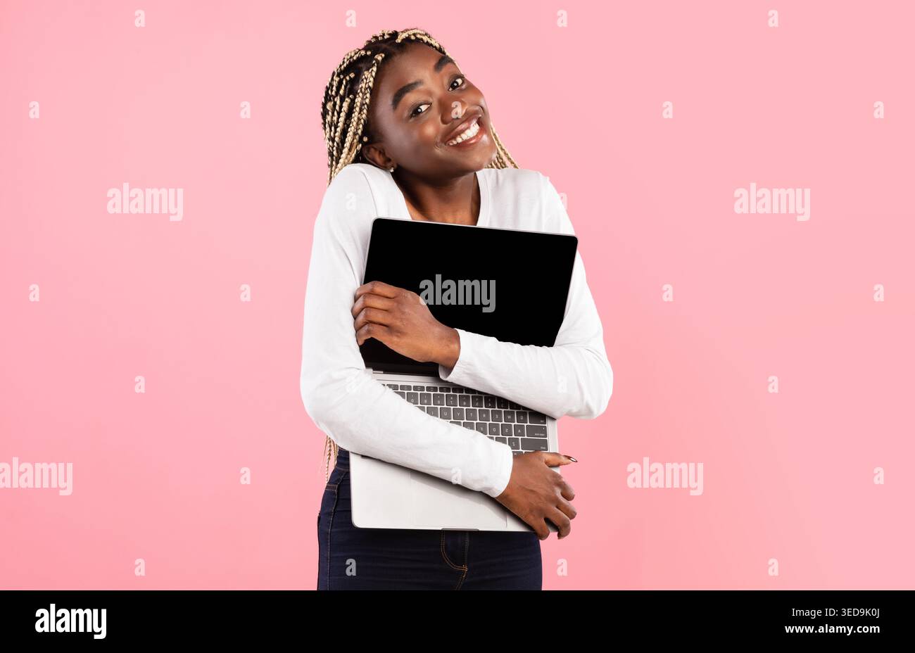 Technology Lover. Excite black woman hugging personal computer Stock Photo
