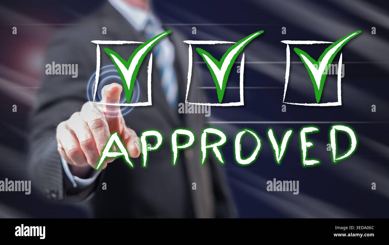 Man touching a validation concept on a touch screen with his fingers Stock Photo