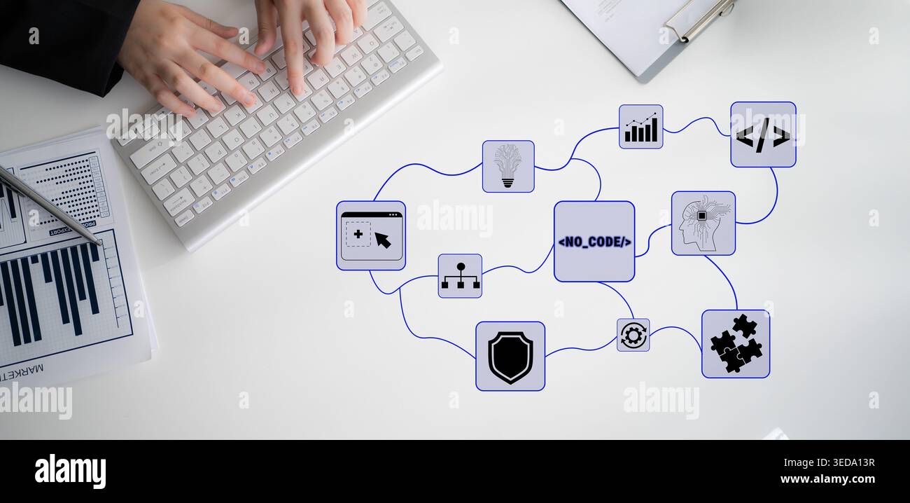 Hands Typing on Keyboard with Flowchart Elements for No-Code Solutions in a Modern Workspace Environment Featuring Data Visualization and Technology Stock Photo