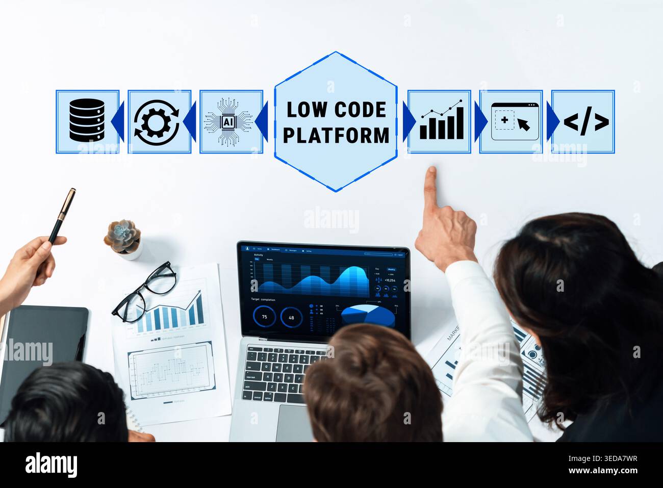 Professionals Collaborating on Low Code Platform Project with Laptop and Visual Data Presentation in Modern Office Setting Quark. Stock Photo
