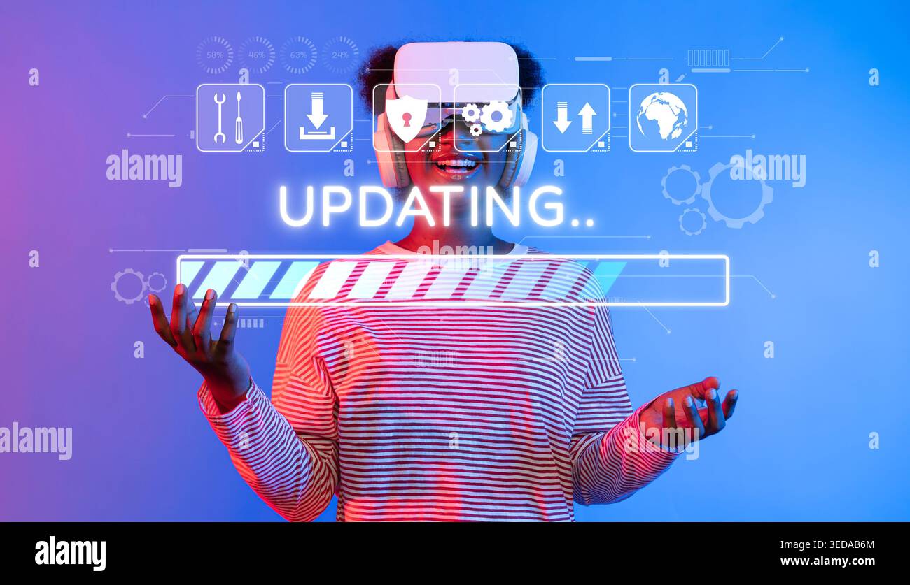 A young individual wearing a virtual reality headset engages in a software update, visualizing a progress bar, representing modern technology and Stock Photo