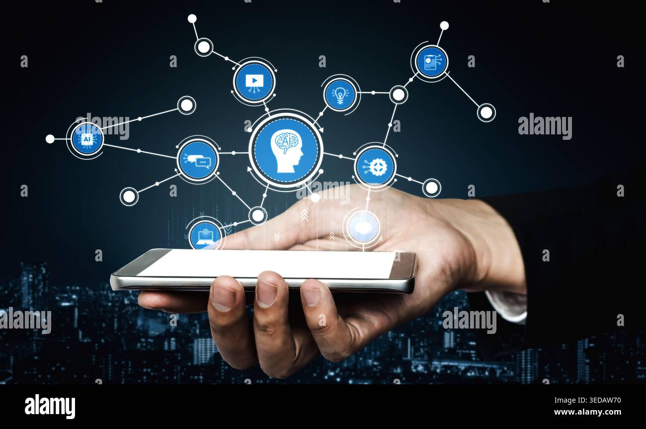 A hand holding a smartphone displays an array of floating digital icons, symbolizing the intersection of technology and innovation against a dark Stock Photo