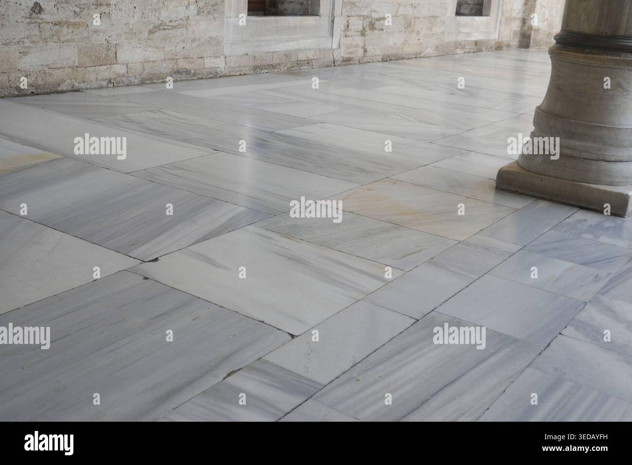 Marble flooring with a column in a historical setting Stock Photo
