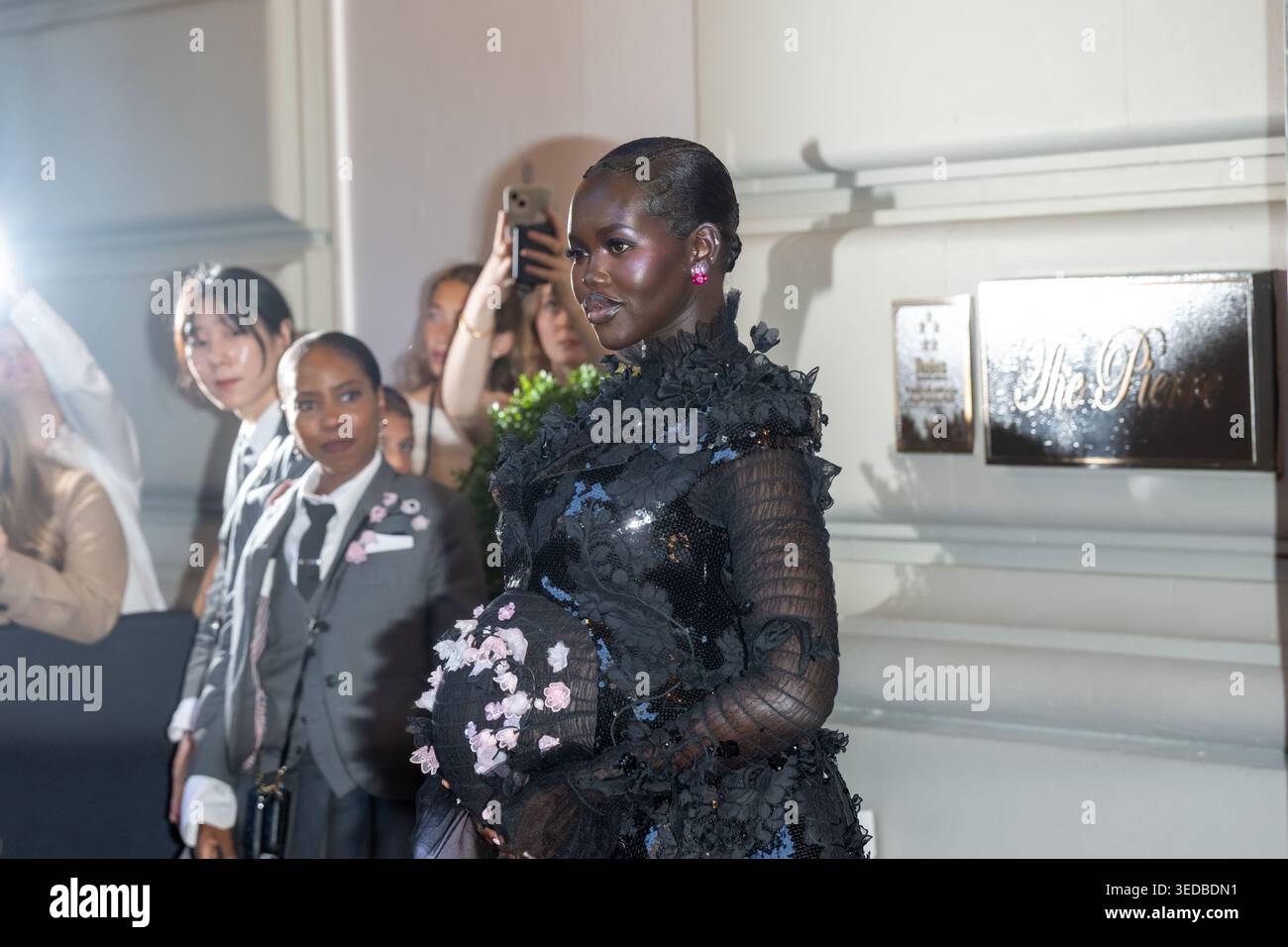 Adut Akech wearing Thom Brown departs the Pierre Hotel for 2026 Met ...