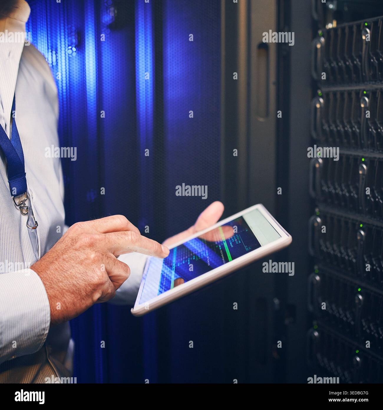 Hands, technician or code on tablet screen in server room for CPU usage, track assets or IT support. Engineer, man and tech in dark data center for Stock Photo