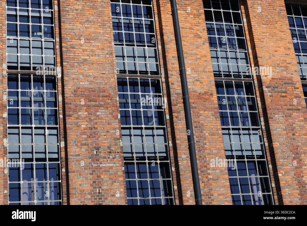 Red Brick Industrial Building Facade With Windows Stock Photo