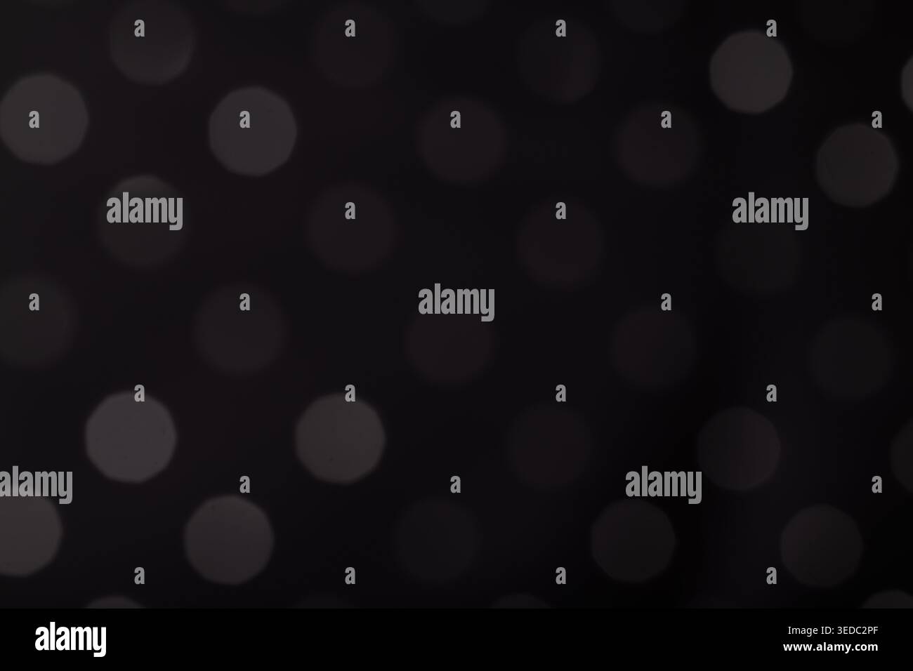 Abstract Grey Bokeh Dots on Black Background Stock Photo