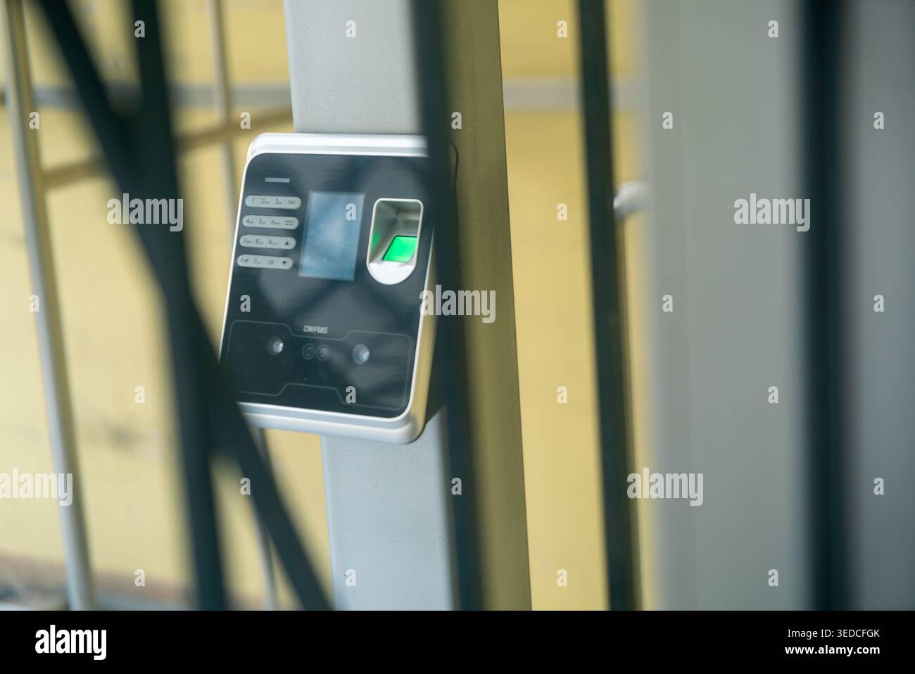 This image features a biometric security access device mounted on a post, showcasing modern technology for entry control and identification. Stock Photo