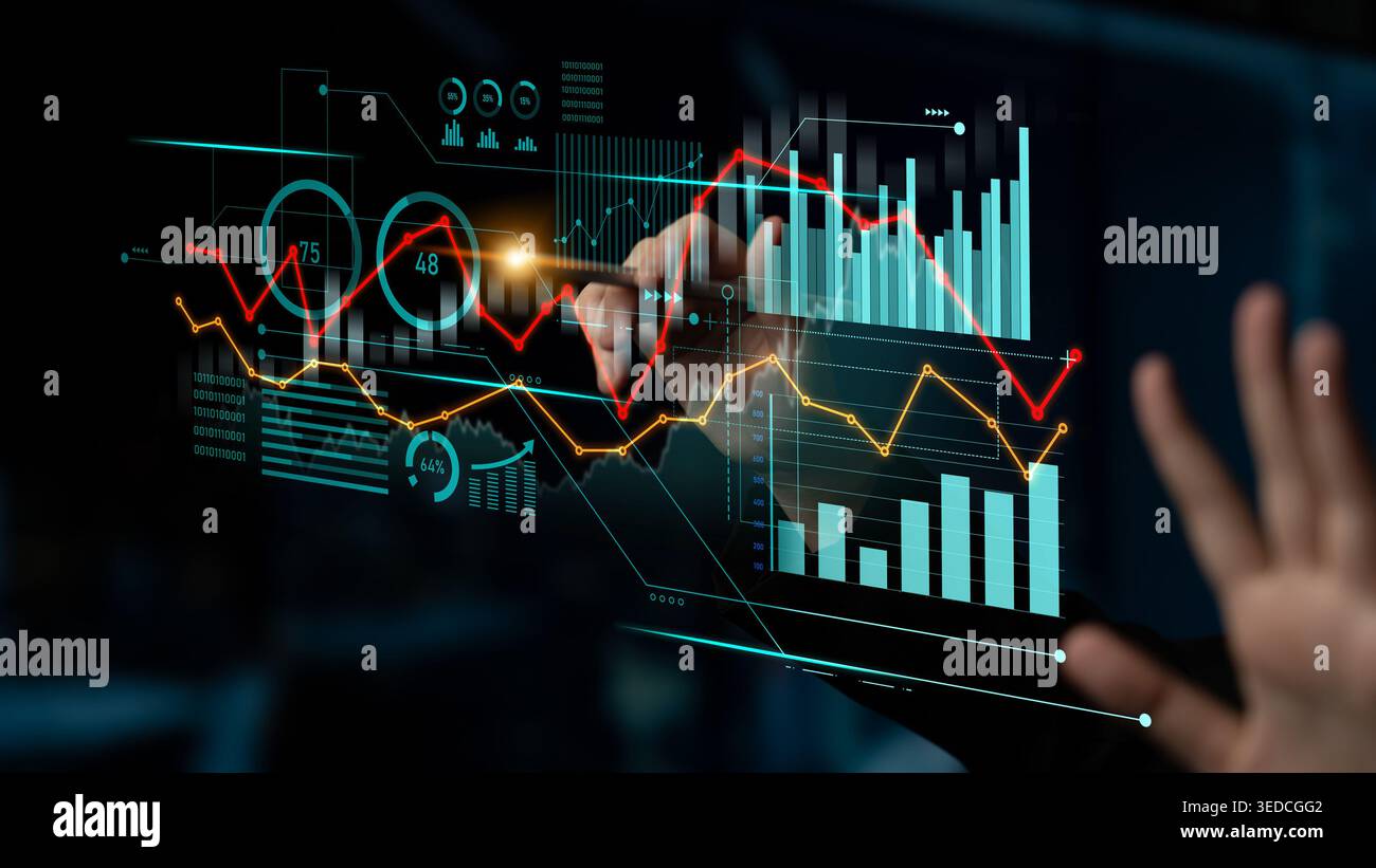 A user interacts with a digital analytics dashboard displaying financial graphs and data visualizations, showcasing modern technology and business Stock Photo