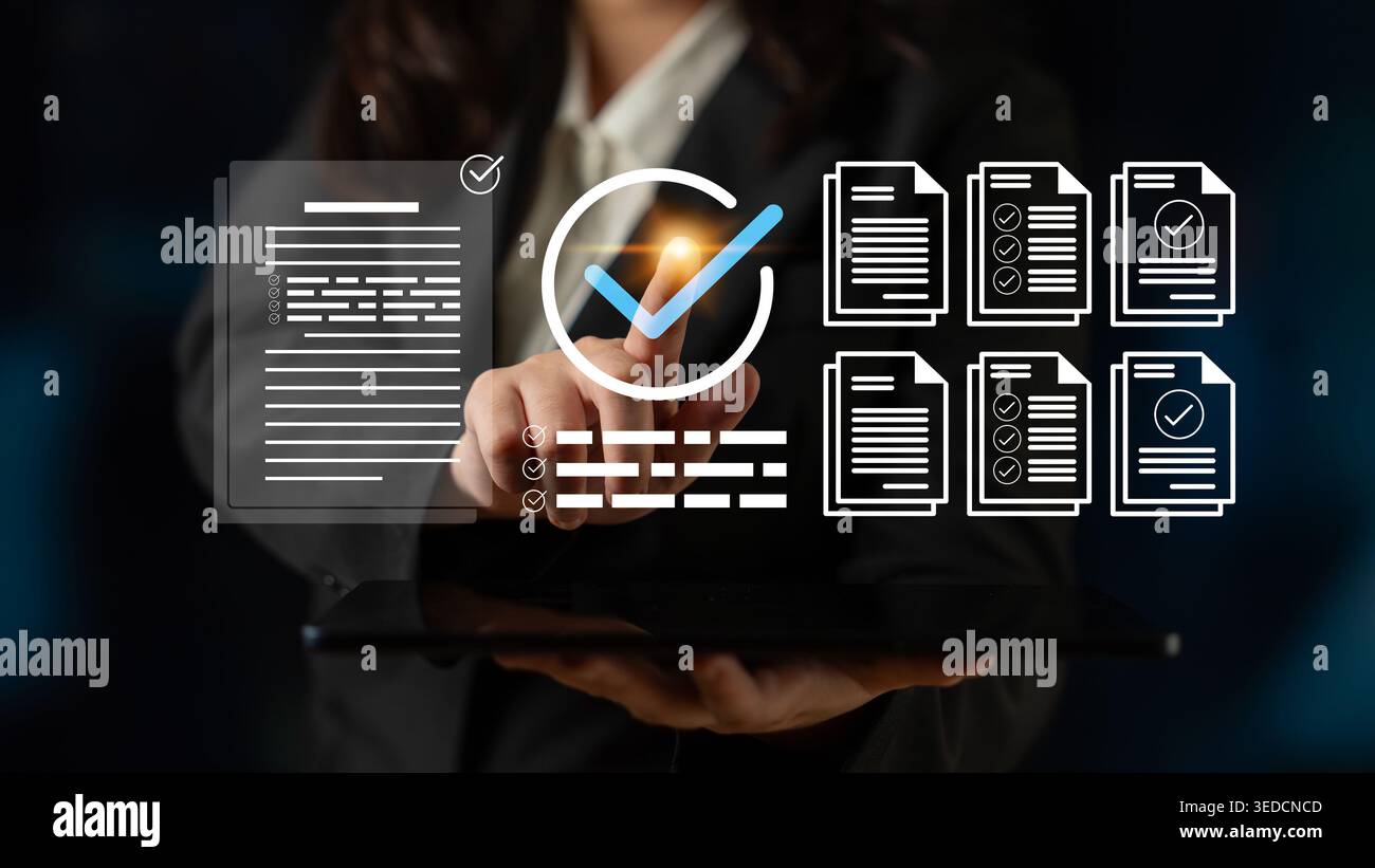 A business professional engages with a digital tablet to verify documents, showcasing workflow icons and checkmarks in a sleek office setting for Stock Photo