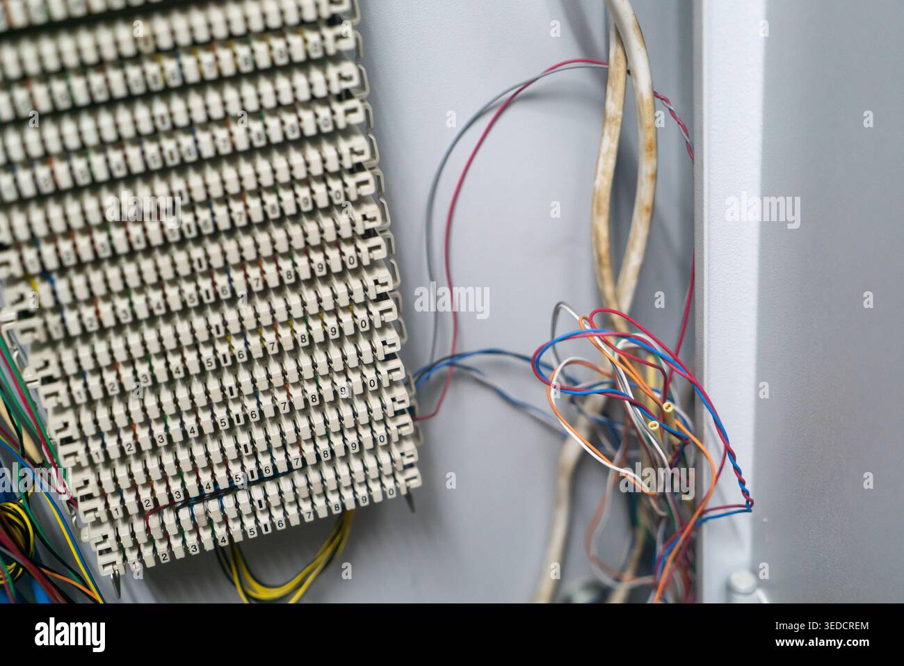 Detailed view of wiring in a communication panel, showcasing various ...