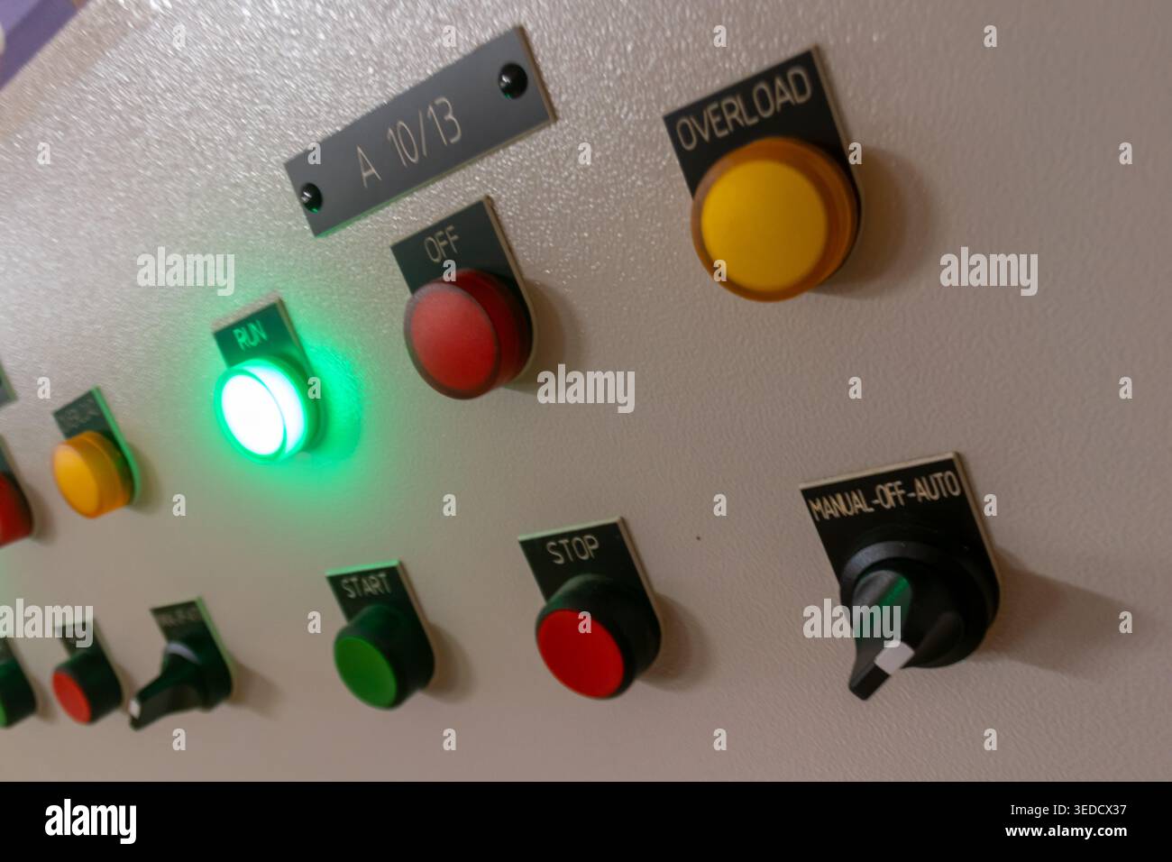 A close-up view of a control panel featuring various buttons and ...