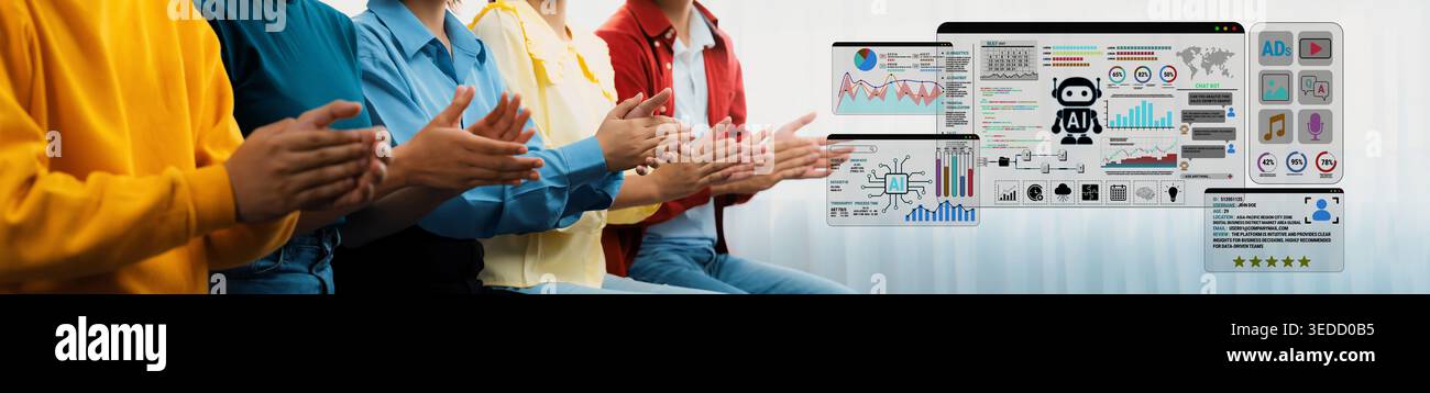 Group of people applauding in an office setting with digital screens displaying charts, graphs, and data analytics related to business performance and Stock Photo