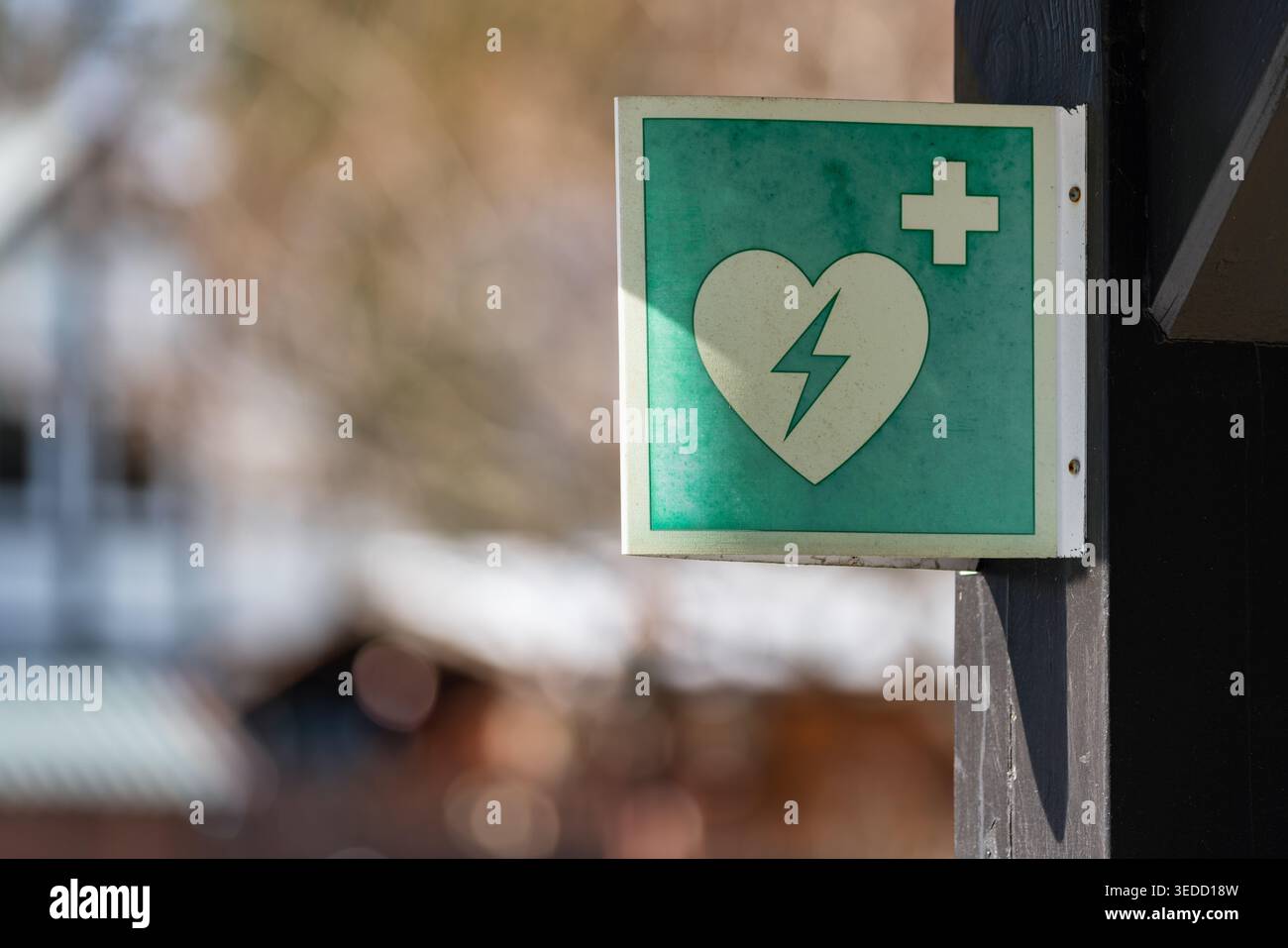 Defibrillator sign with heart symbol and lightning icon mounted on a ...