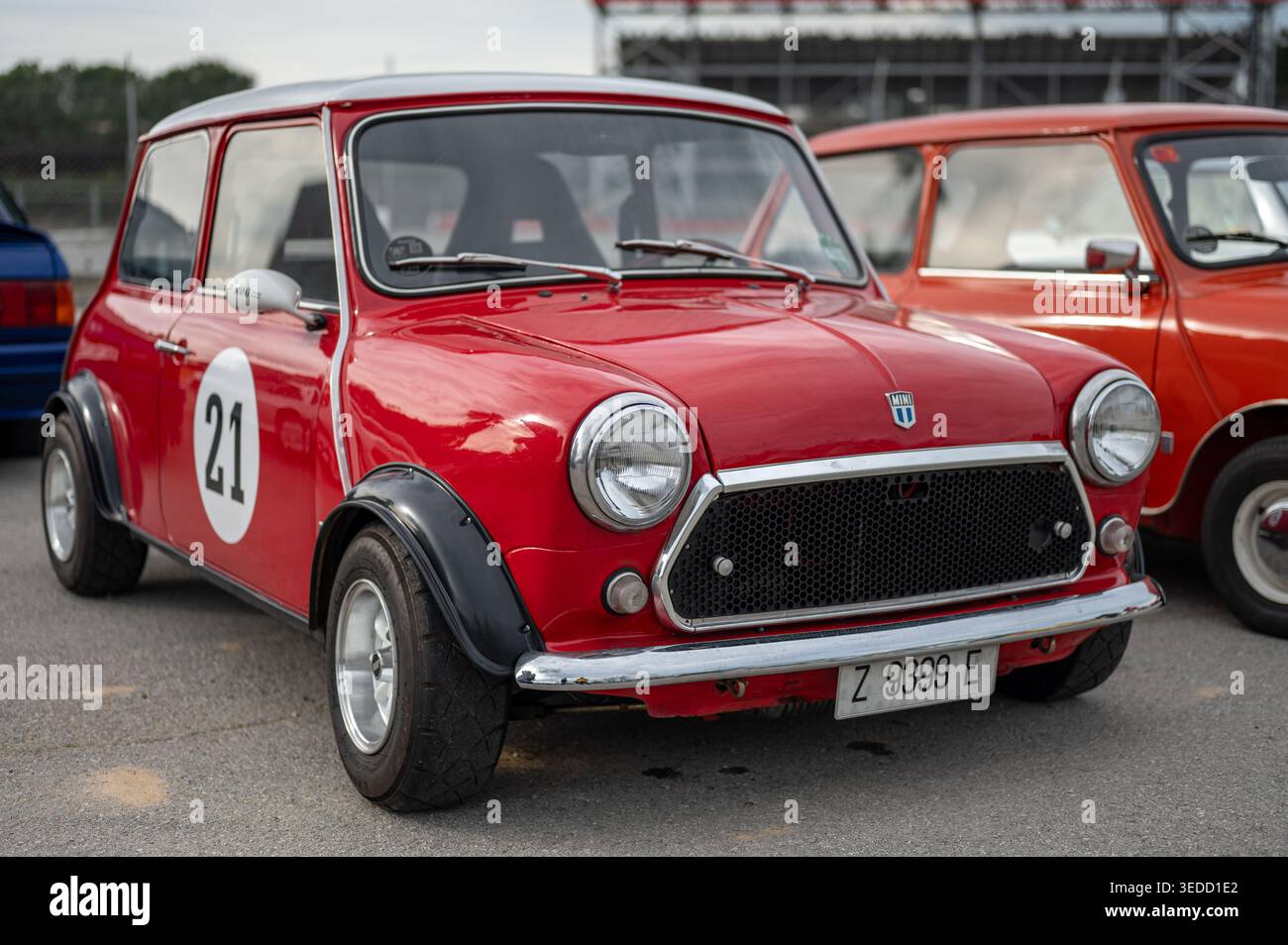 Front three-quarter view of a red classic Mini Cooper racing car with ...