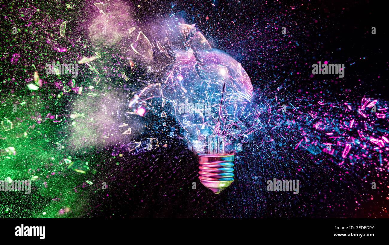 Real Light bulb shattering black background Stock Photo