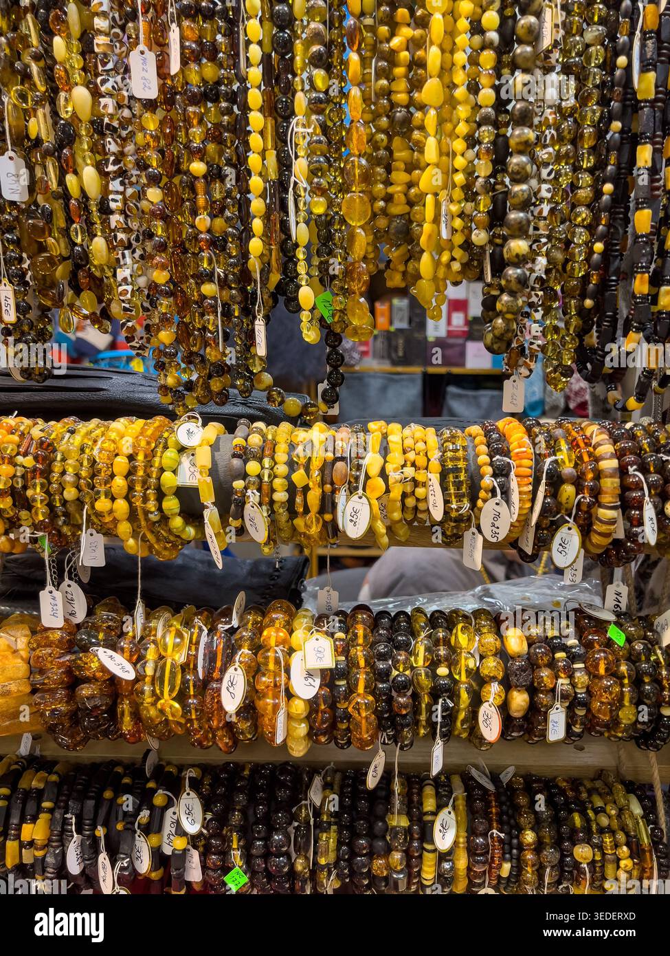 Riga, Latvia-April 3, 2026: Baltic amber jewelry displayed in riga central market reflects natural materials, regional identity and handmade accessory Stock Photo