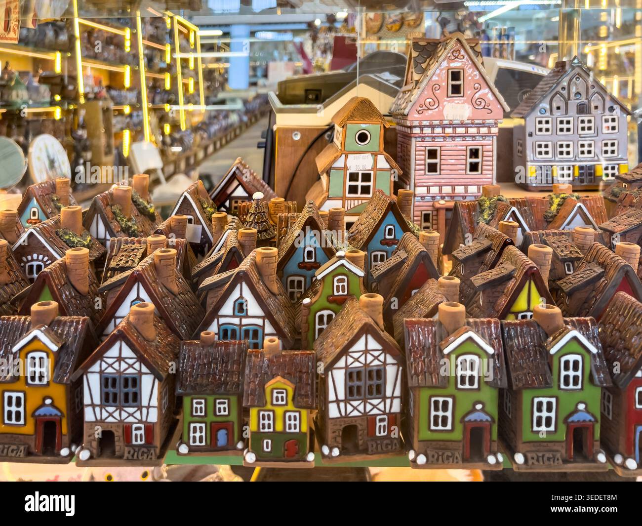 Souvenir houses displayed in market stall reflect architectural identity, local design and travel memory objects, copy space Stock Photo