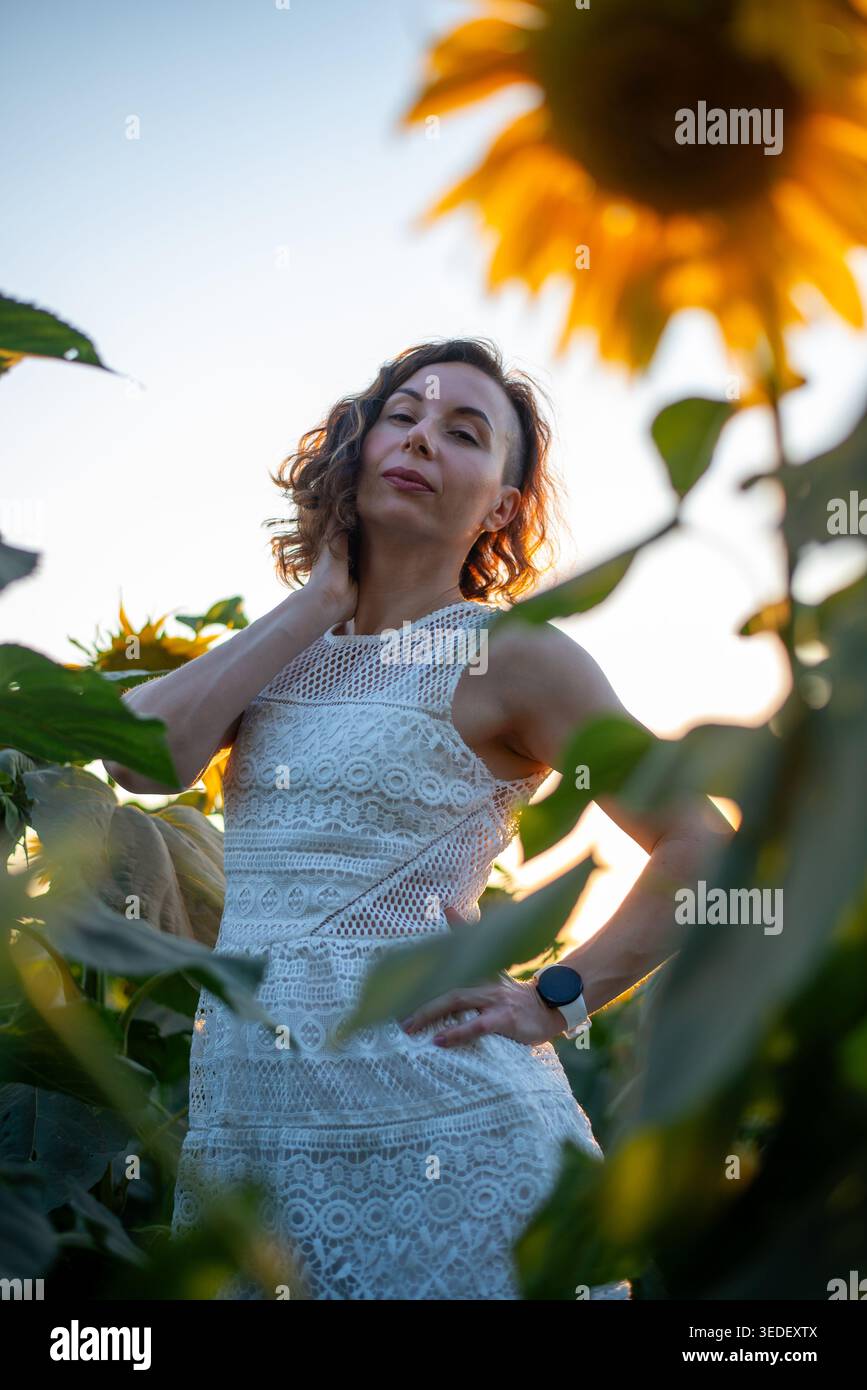 Confident woman wearing a white dress hi-res stock photography and images -  Alamy