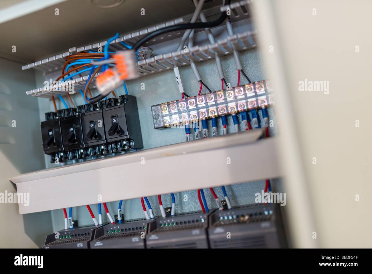Detailed view of an electrical control panel showcasing various wiring ...