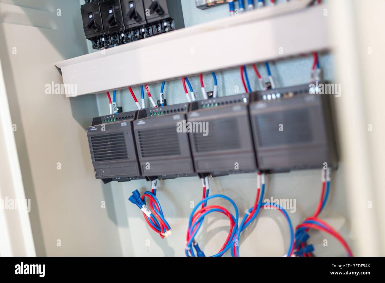 Interior view of an electrical control panel featuring neatly arranged ...