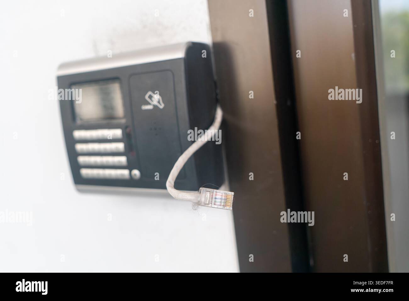 A modern security intercom system featuring a keypad and card reader for enhanced access control. Ideal for buildings and homes seeking reliable entra Stock Photo
