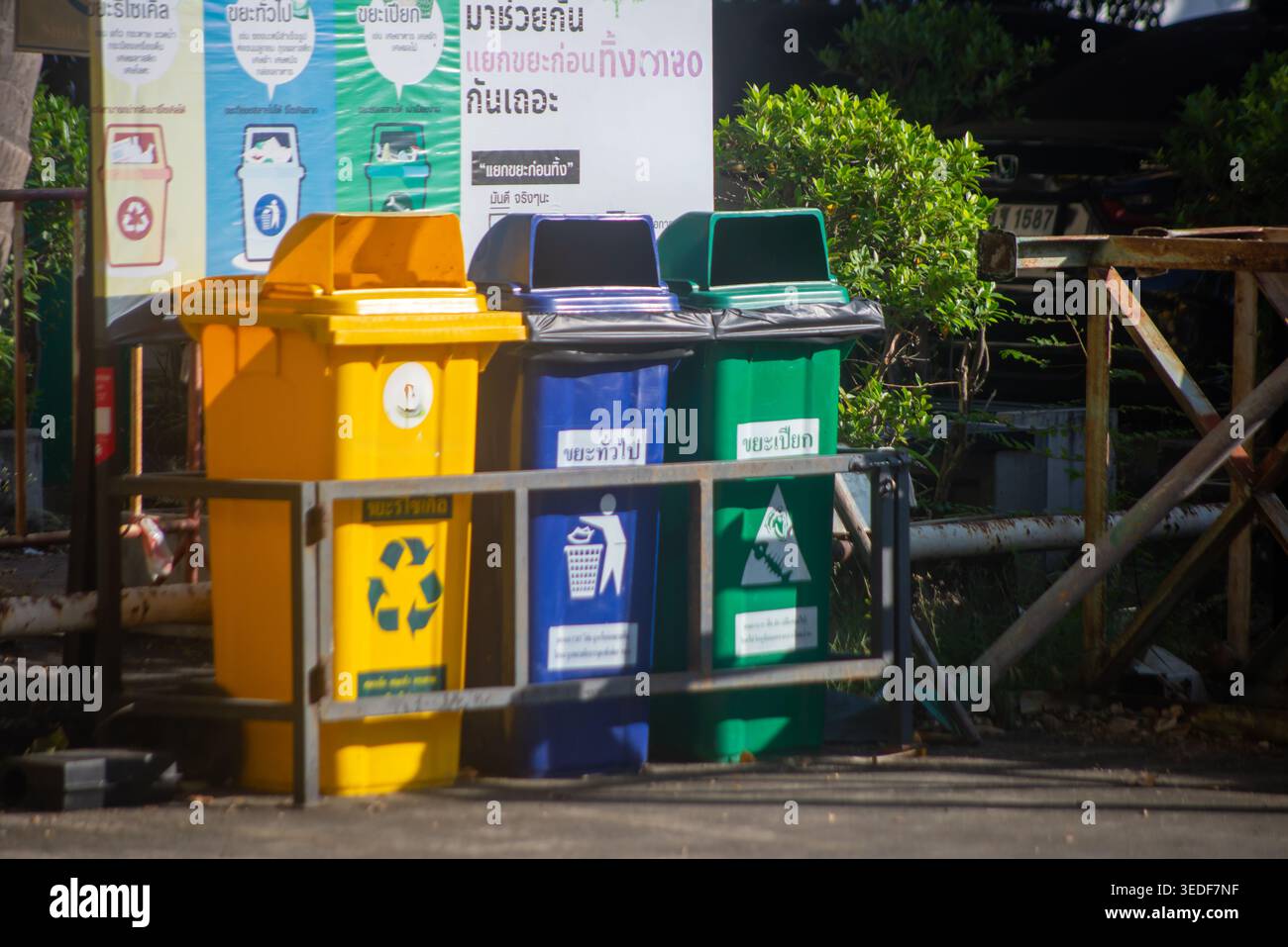 Colorful recycling bins in an urban area promote environmental ...