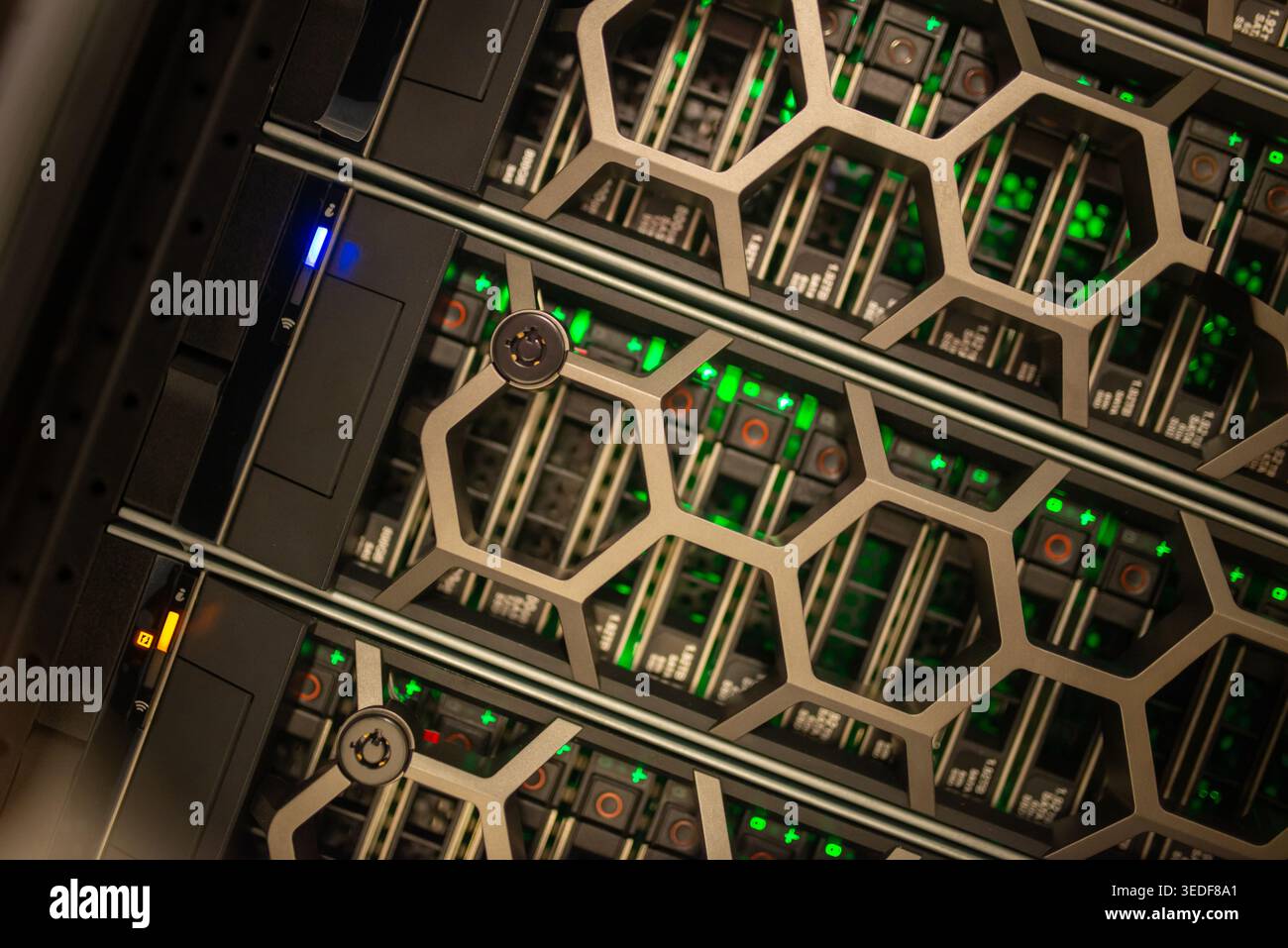A close-up view of a modern data center rack displaying illuminated components, showcasing high-performance computing and efficient data management te Stock Photo