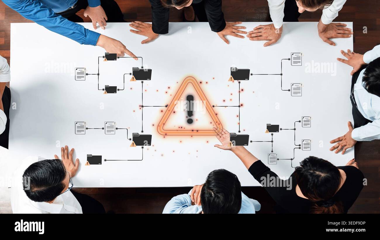 Group of Business Professionals Analyzing Risk Management Process with Warning Symbol on Table During Meeting Sigmoid Stock Photo