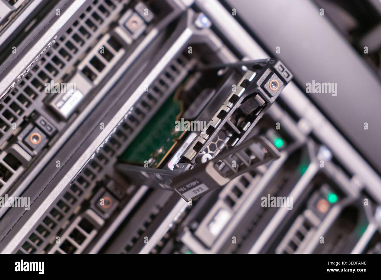 Close-up of a server storage array featuring a hard drive being ...