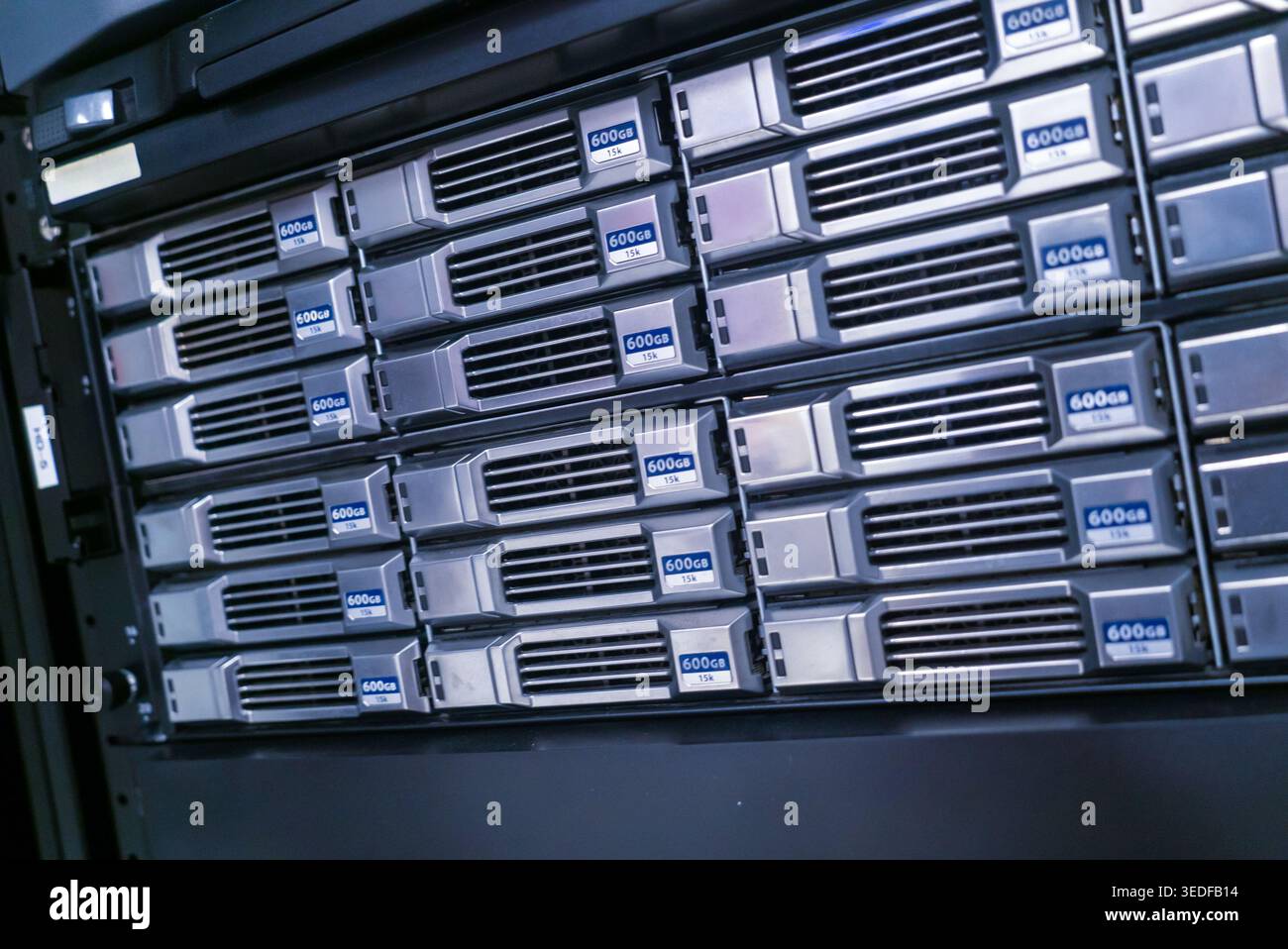 Close-up view of a high-performance data storage server rack featuring multiple units, designed for efficient data management and processing in IT env Stock Photo