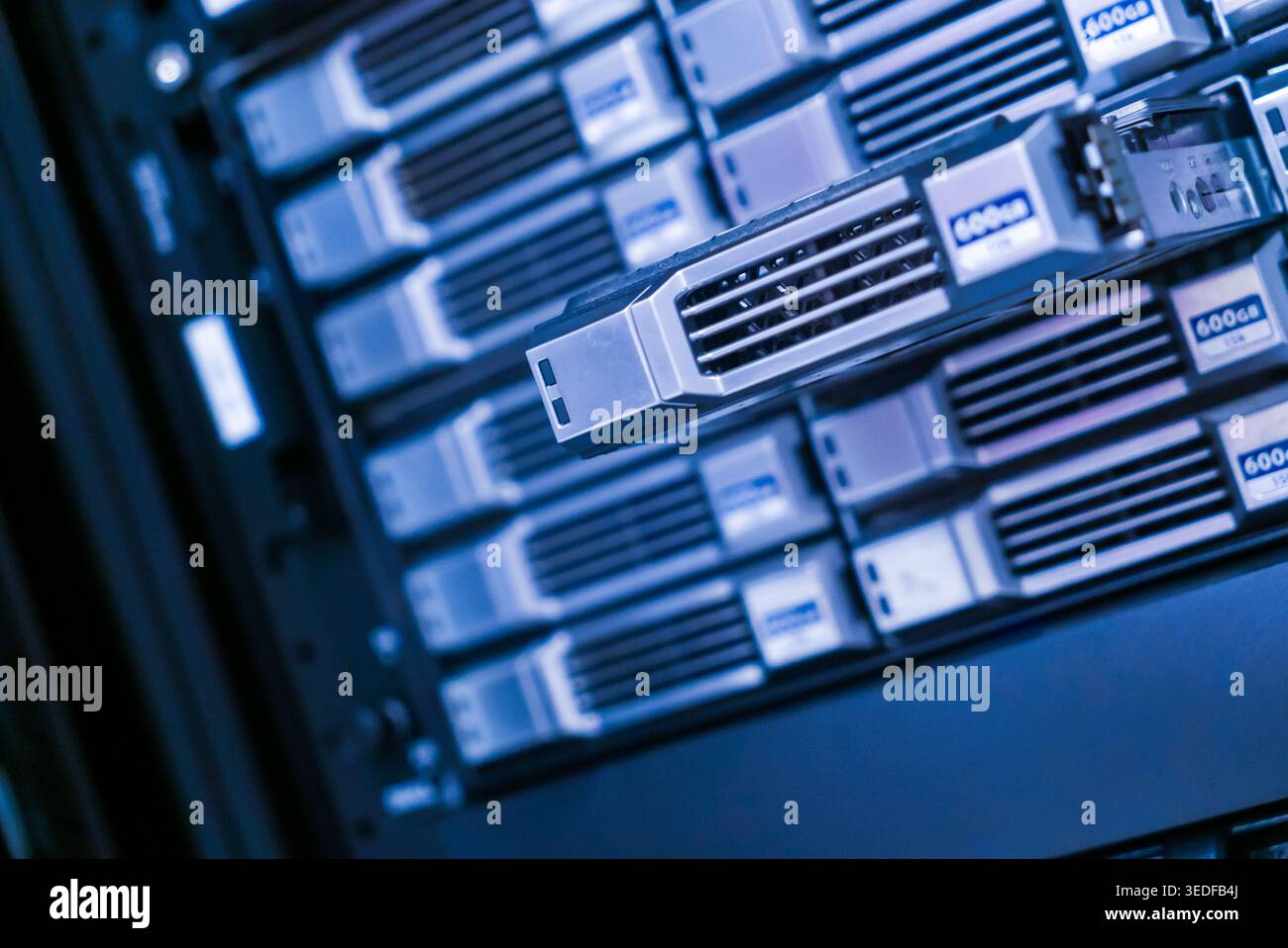 This image showcases advanced data storage technology within a server rack, emphasizing modern computing solutions crucial for data management and pro Stock Photo