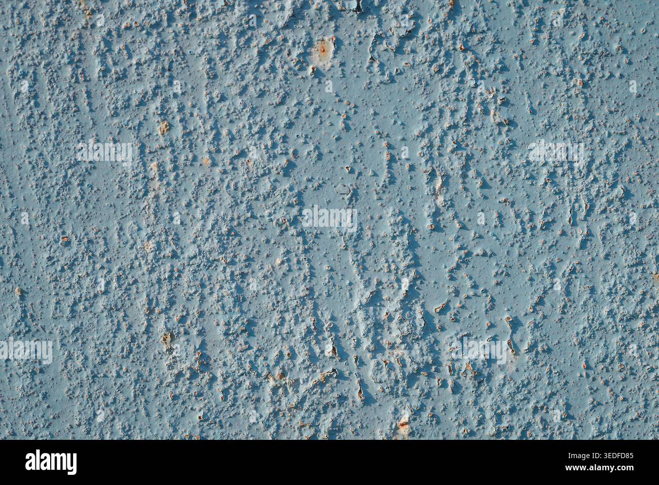 Light blue painted metal texture with small rust spots and peeling surface Stock Photo