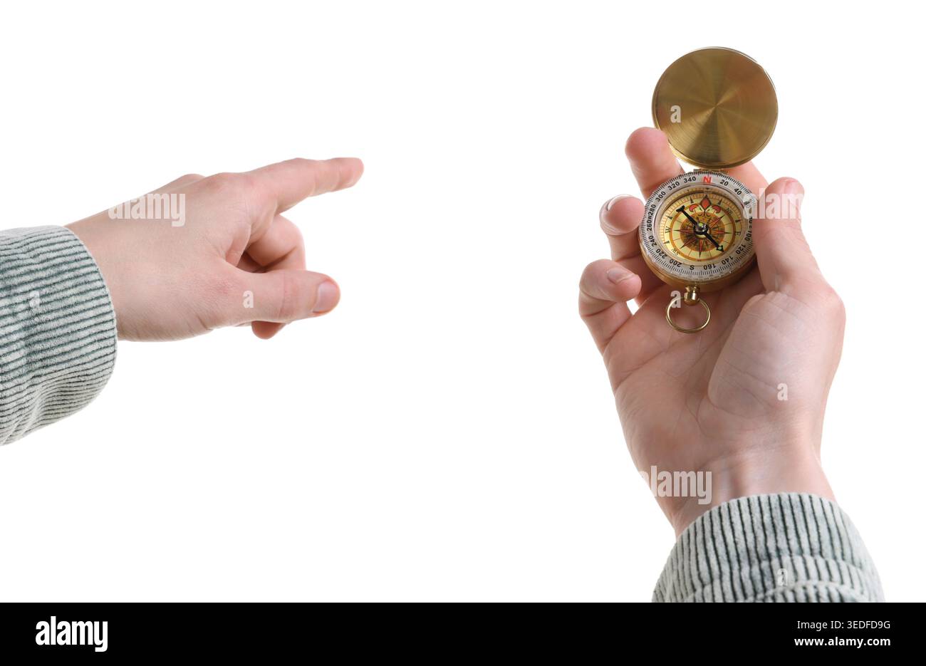 Man with compass pointing in direction on white background, closeup Stock Photo