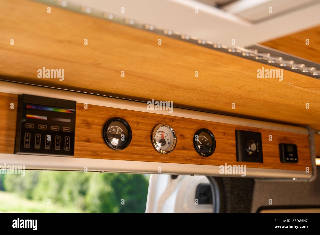 Close-up of a custom control panel in a camper van with analog gauges ...
