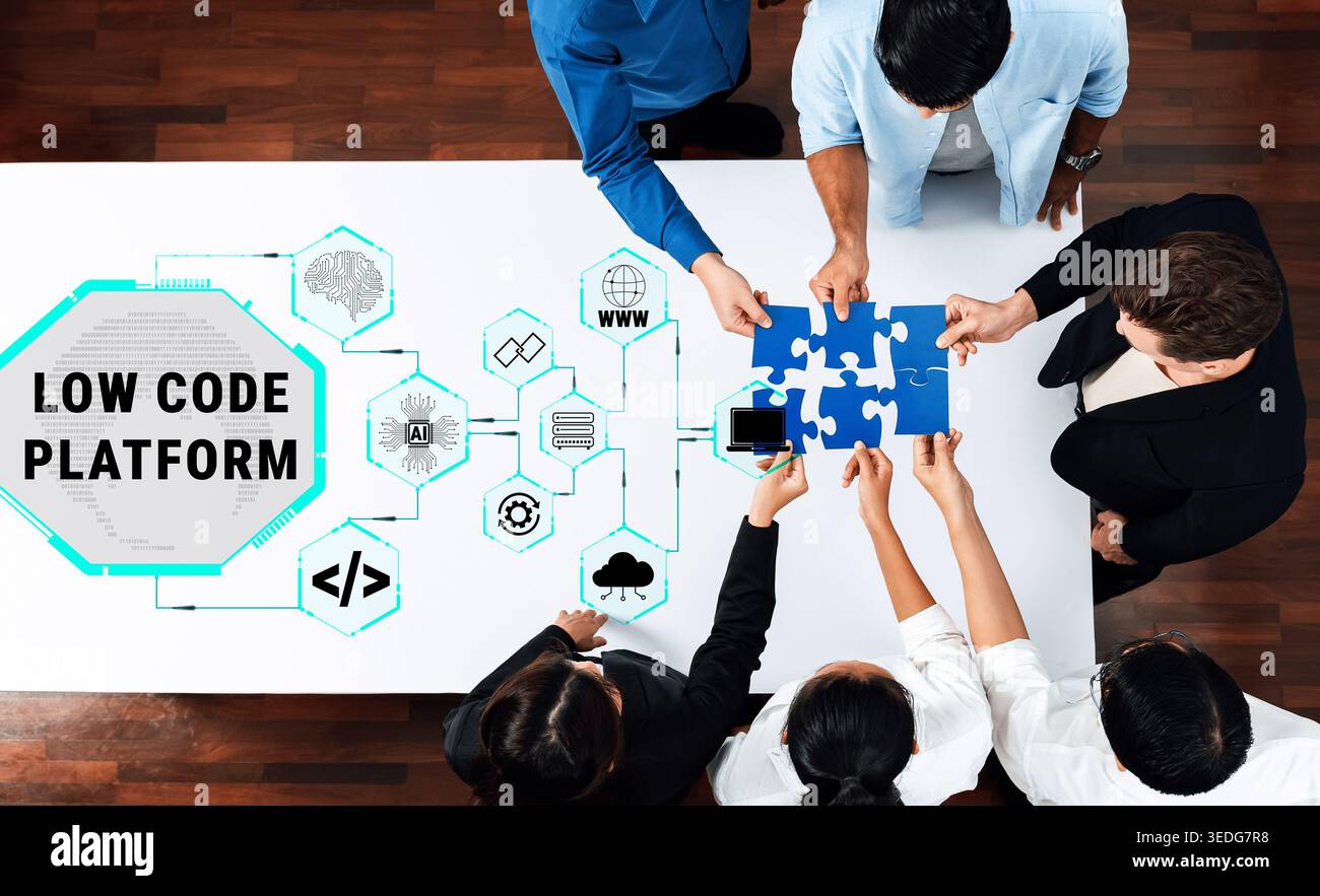 Collaborative Team Working on Low Code Platform with Puzzle Pieces Representing Technology Integration and Innovation in Digital Solutions Quark. Stock Photo