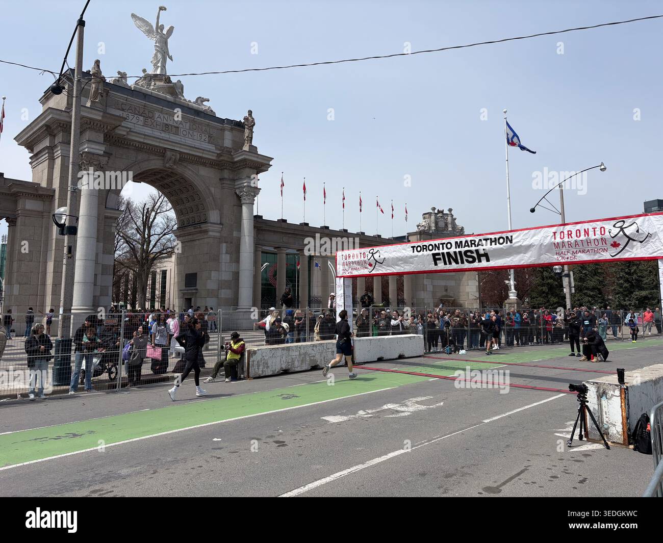 Running Finish Gate Runners at the Toronto Marathon finish line in front of the historic ...