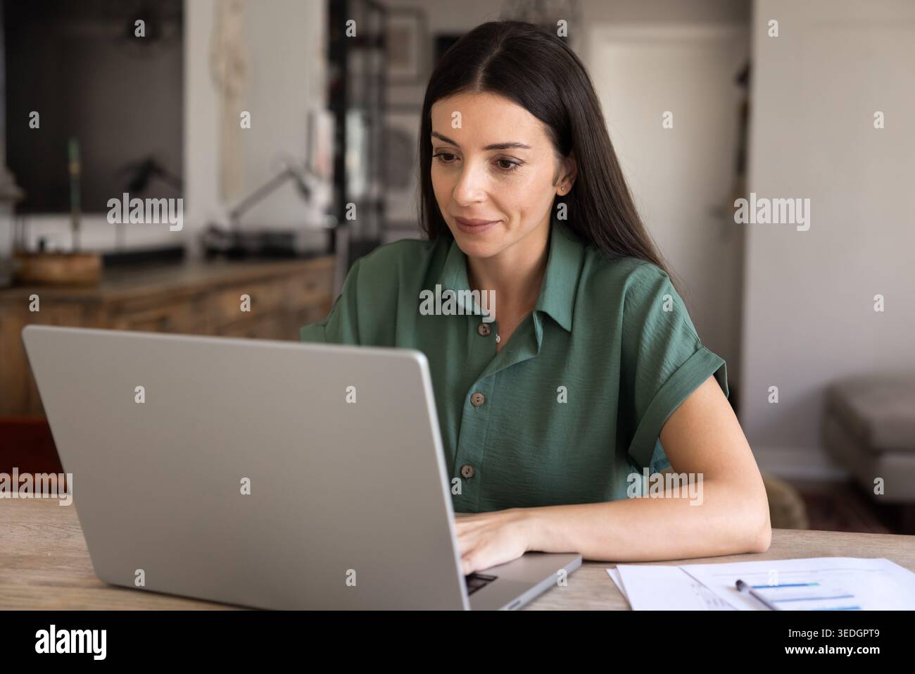 Woman working on project using laptop from homeoffice Stock Photo