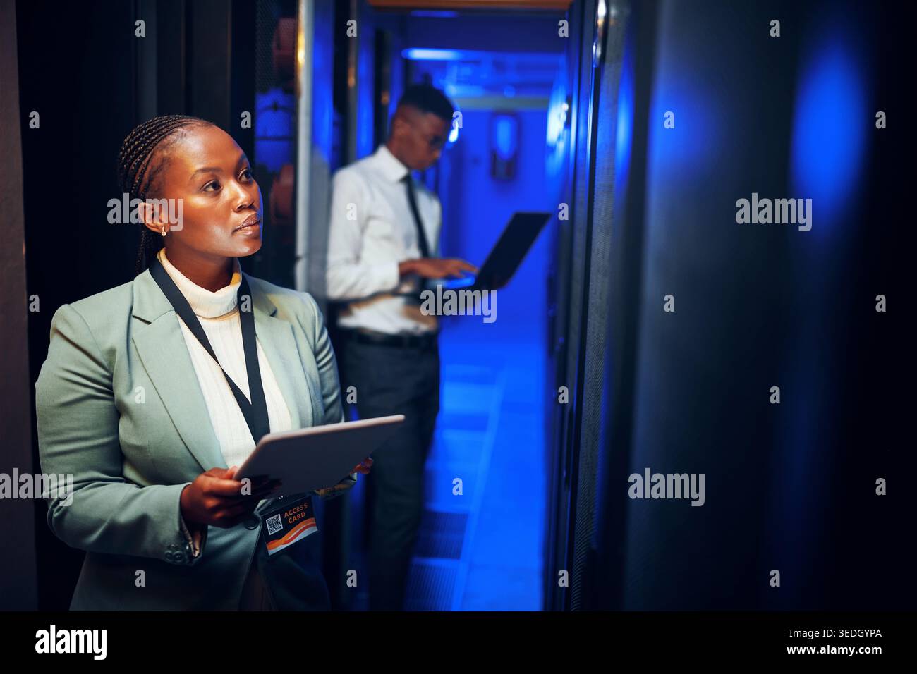 Thinking, programming and black woman in server room, tablet for software development or cyber security. People, programmer or solution in workplace Stock Photo