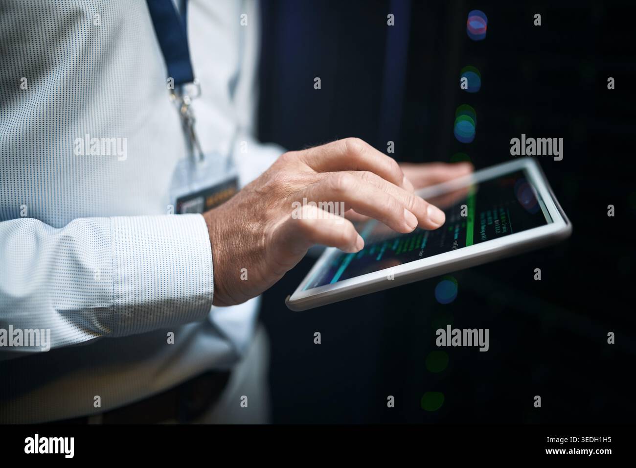 Hands, programming and man in server room, tablet for software development and cyber security. Person, typing and programmer in workplace, connection Stock Photo