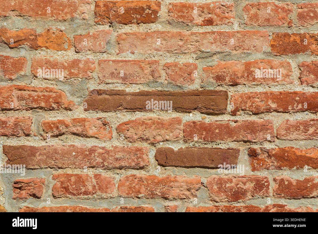 Orange, red and brown brick wall as background Stock Photo