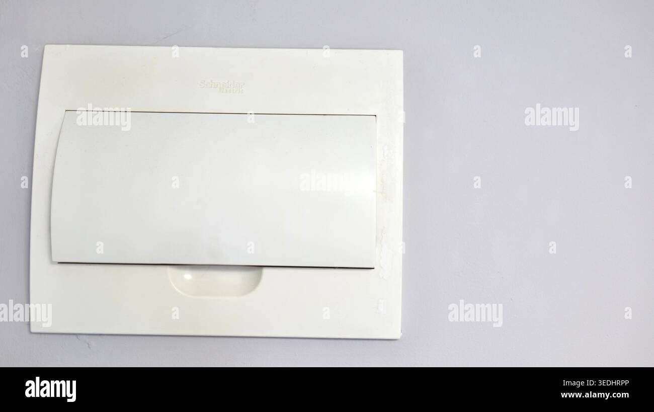 White Closed Electrical Panel in Apartment Interior Stock Photo