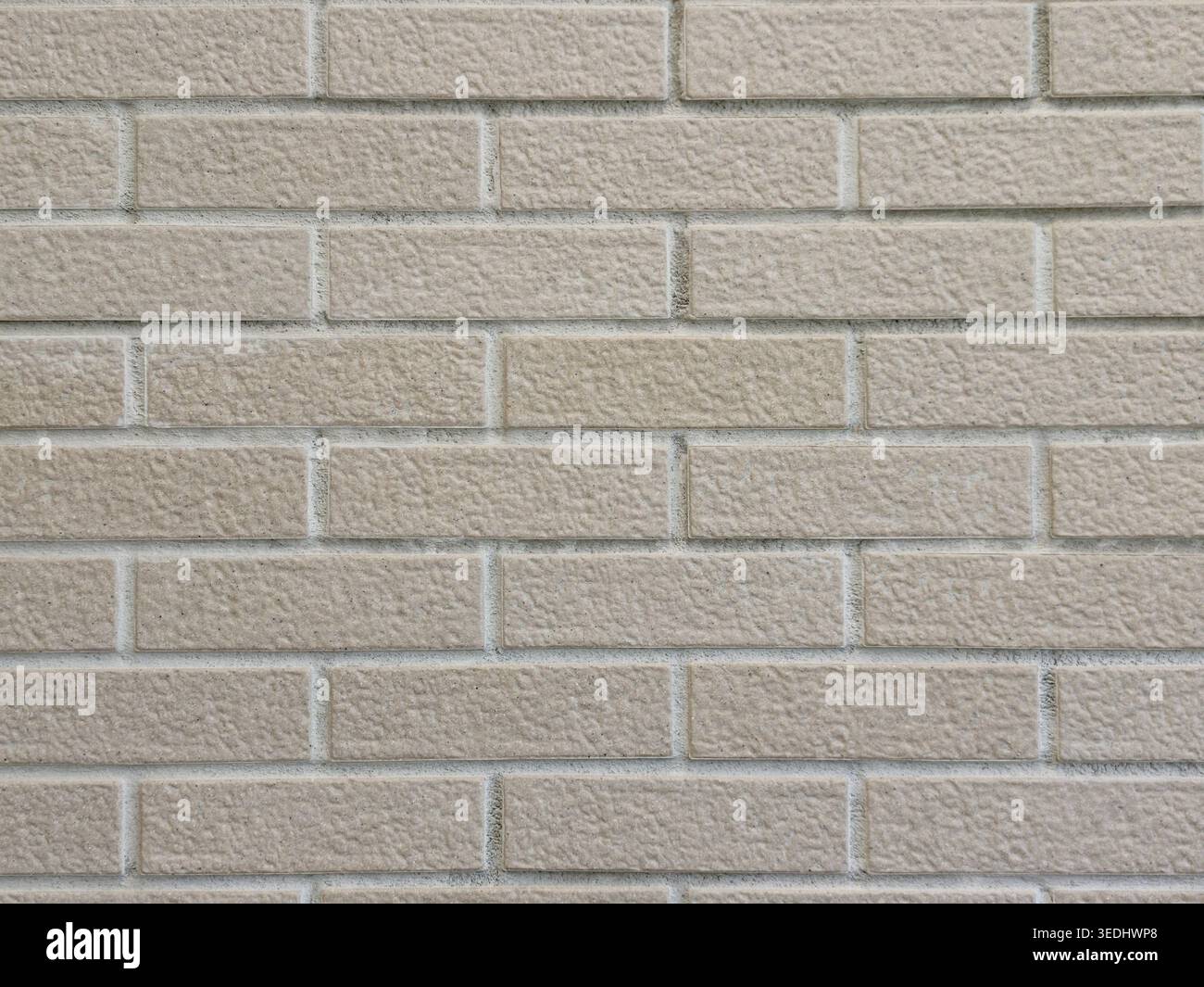 Beige brick wall texture seamless background pattern Stock Photo