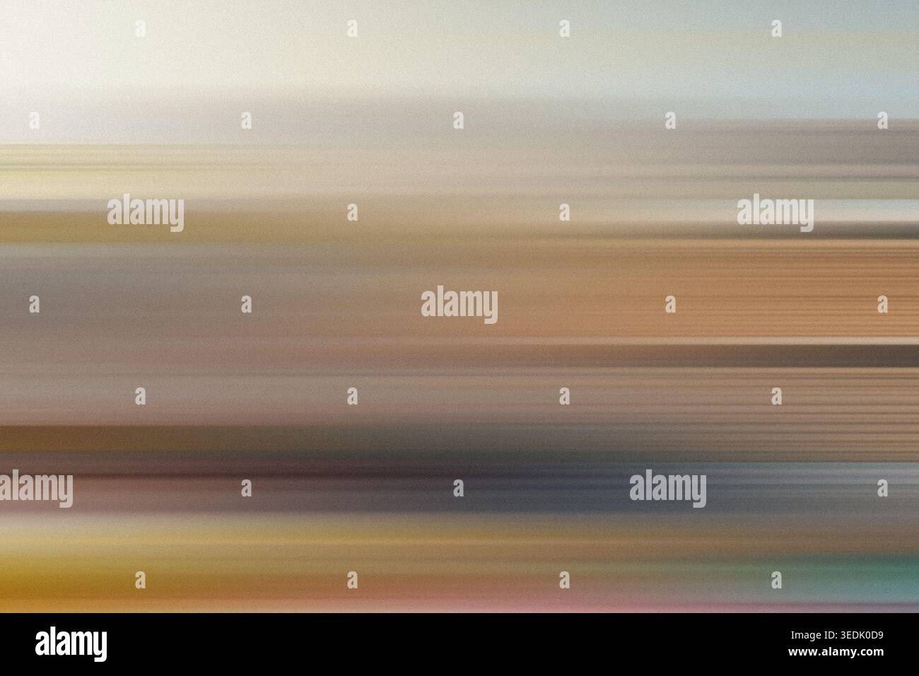 An abstract background featuring horizontal motion blur with a blend of warm earth tones, including brown, tan, and soft golden hues. Stock Photo