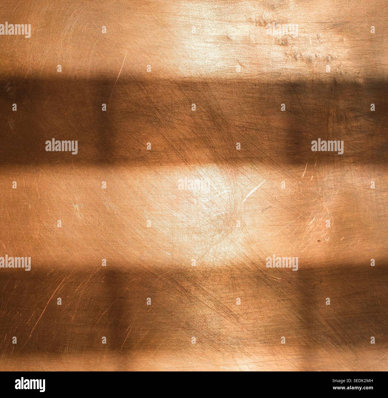 Copper background with shadow stripes. Abstract backgrounds for design. Minimal. Stock Photo