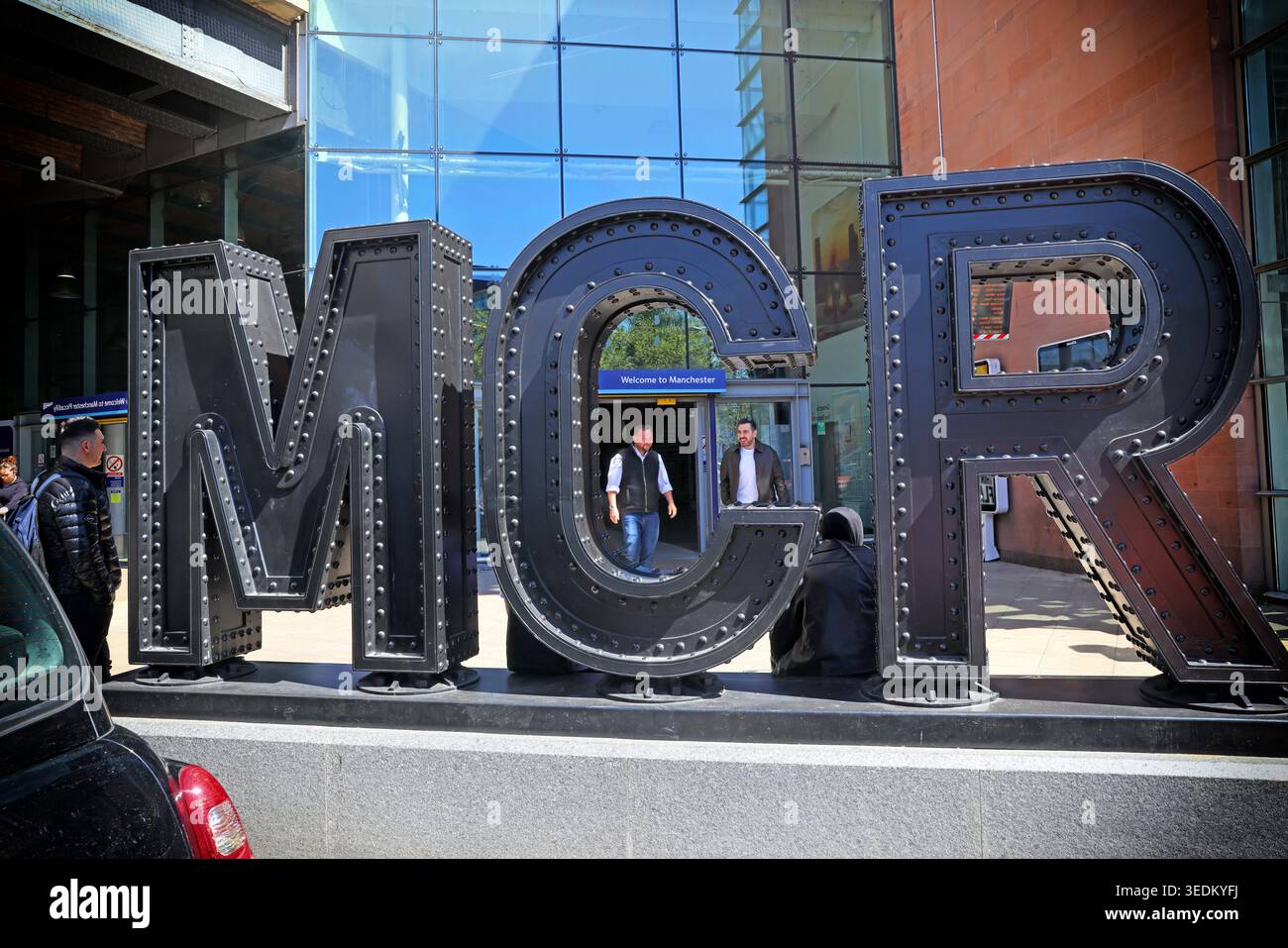 Large riveted MCR sculpture at Manchester Piccadilly, reflecting the city’s industrial and railway heritage Stock Photo
